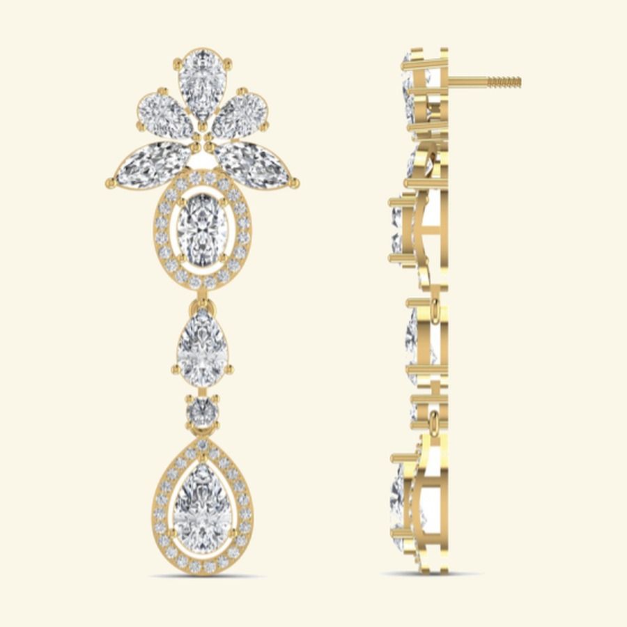 Long drop earrings with diamond starburst tops and elongated pavé tails. — 7.52 GM gold