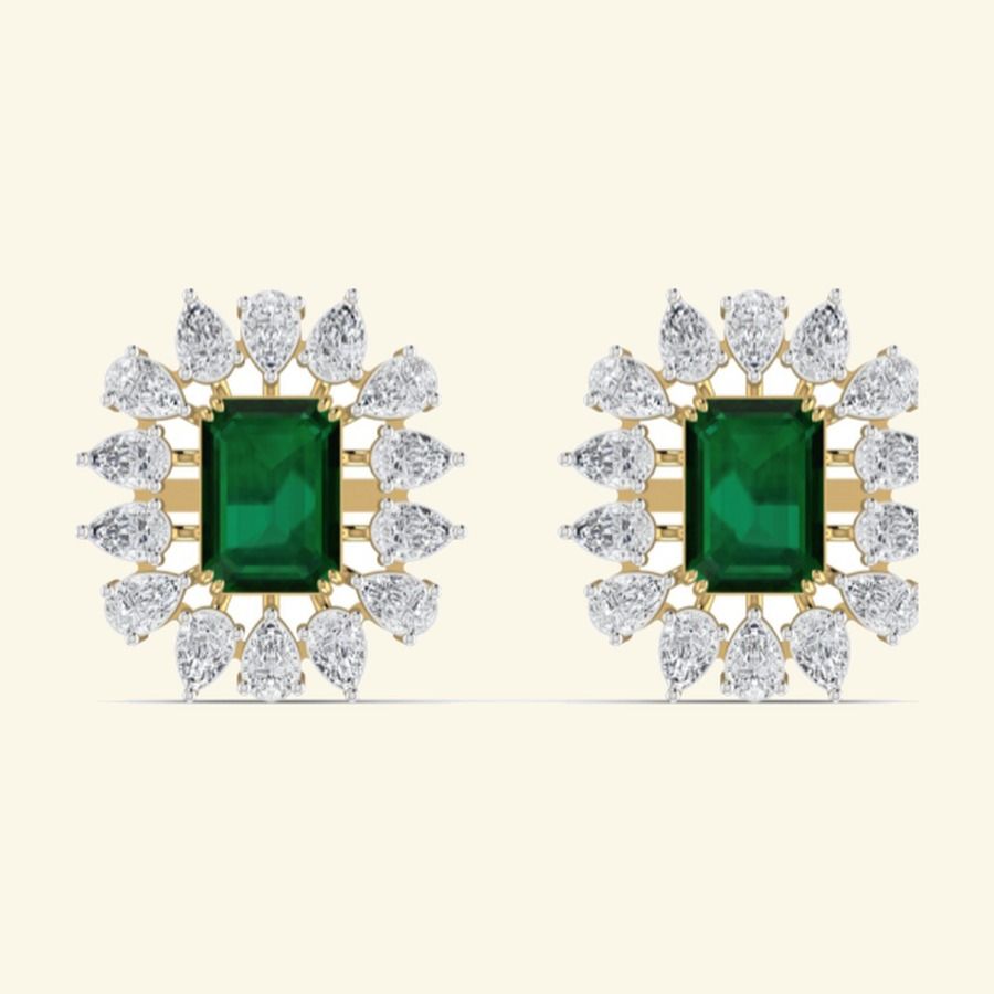 Emerald-cut centre stud earrings with pear diamond cluster halo. — 4.13 GM gold