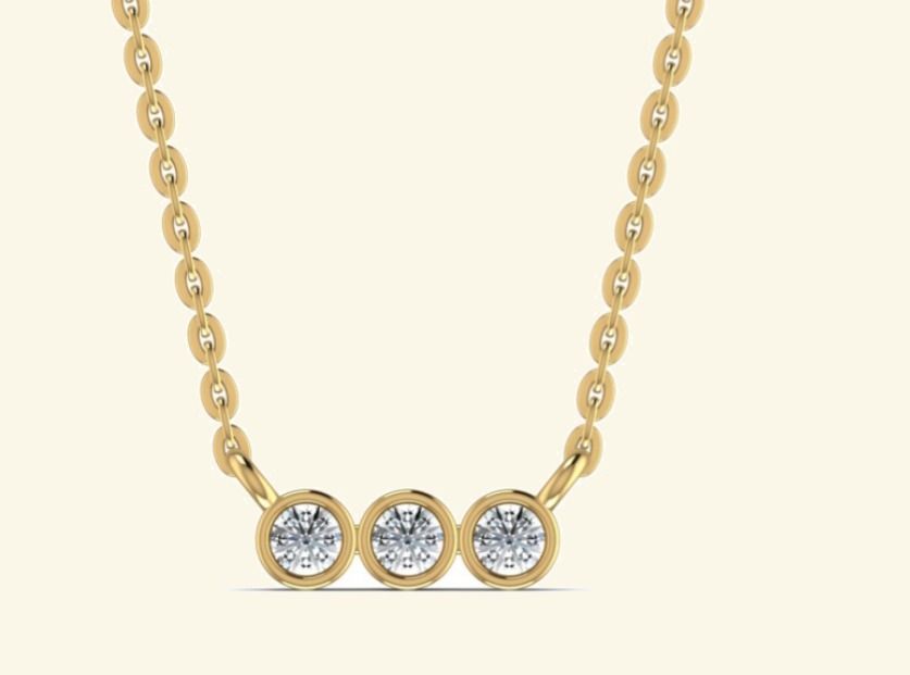 Three bezel-set rounds in a horizontal mini-bar pendant on cable chain. — 1.80 GM gold