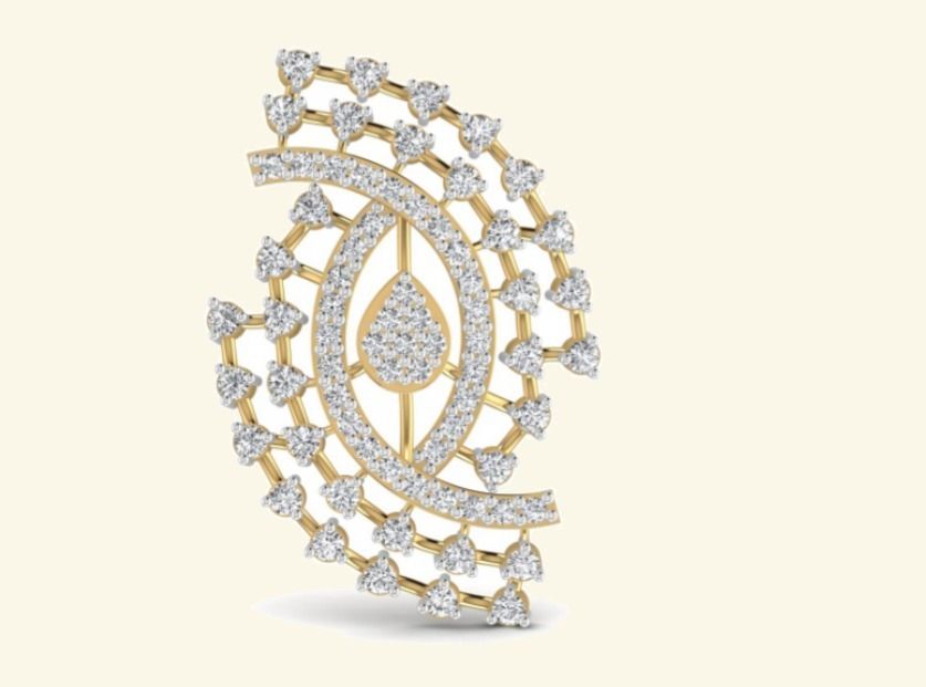 Paisley-shape openwork pendant with pavé eye centre and prong-set rim accents. — 2.65 GM gold