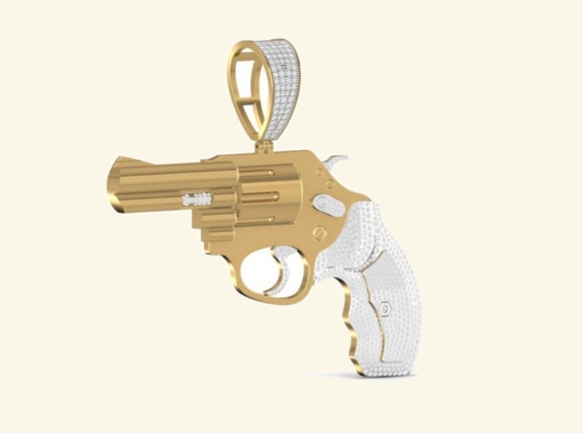 3D revolver pendant with pavé grip and sculpted gold barrel. — 21.40 GM gold