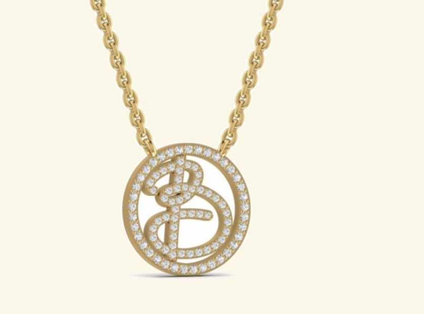 Round openwork pendant with cursive B letter and pavé halo borders. — 1.98 GM gold